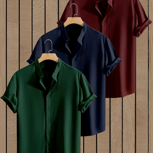 Dandych breathable mens summer shirts in green, navy, and burgundy hanging on a wooden rack