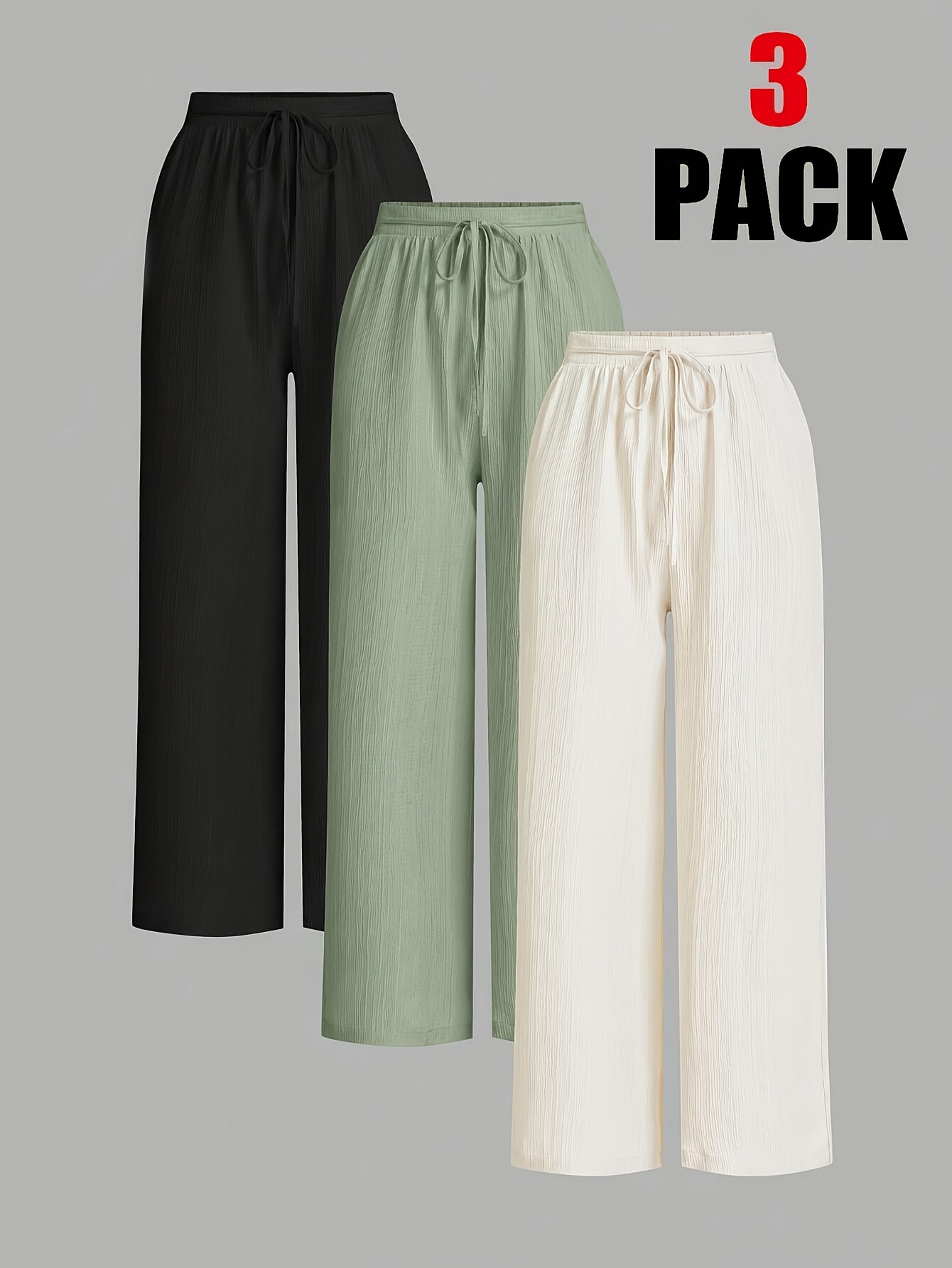 Three-pack of Dandych comfortable women's trousers in black, green, and white for casual wear