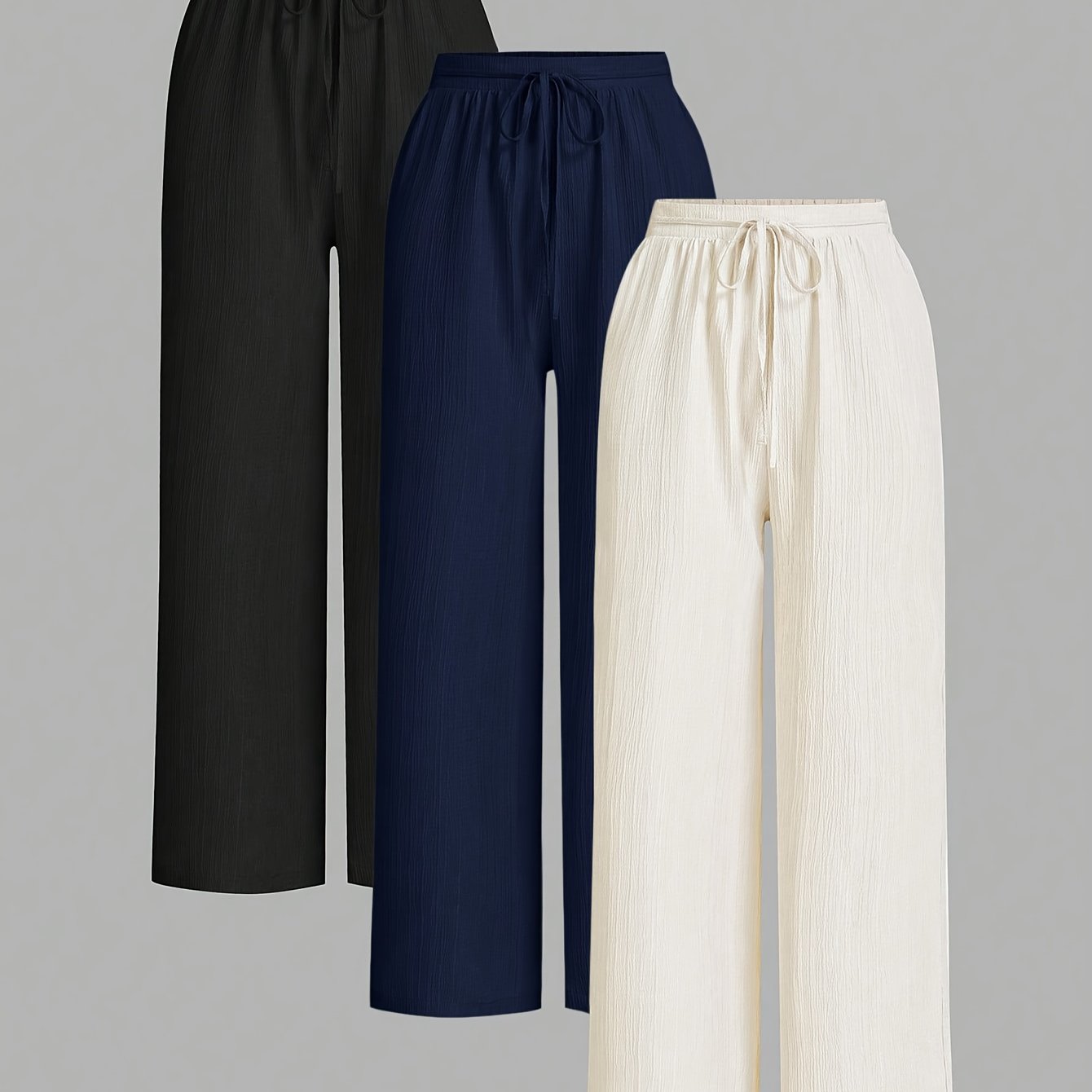 Dandych comfortable women's trousers in black, navy, and cream with elastic waistband and flowy design