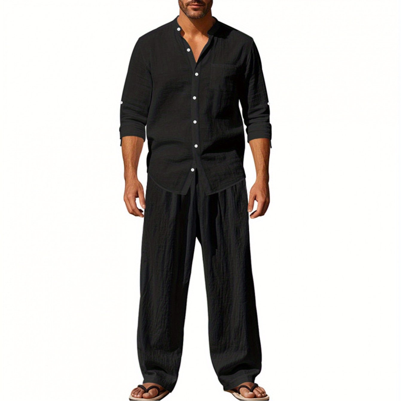 Men's black linen outfit featuring a button-up shirt and loose trousers for effortless style linen clothing