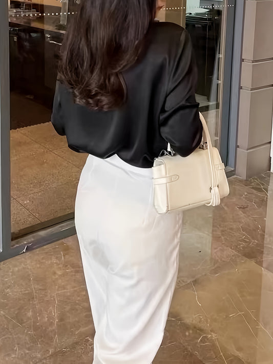 Elegant black blouse with white high-waisted trousers, perfect for formal workwear for women