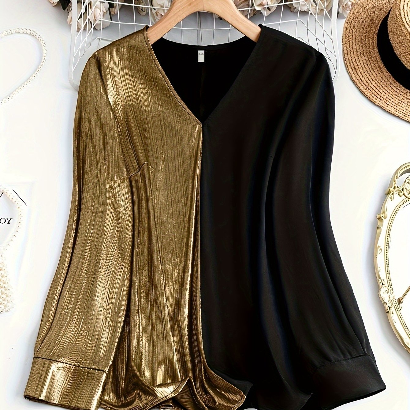 Gorgeous long sleeve top in black and gold colorblock style for a fashionable look