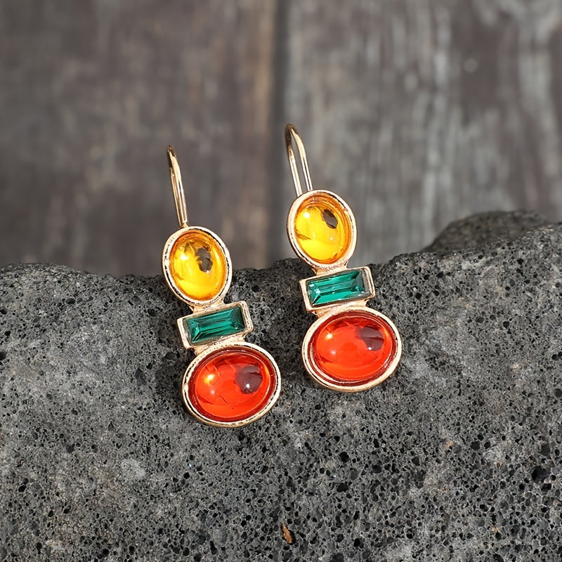 Dandych luxury emerald earrings featuring vibrant orange and yellow gems in a unique design