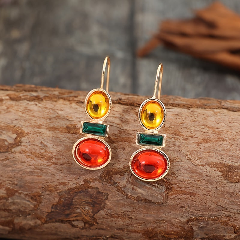 Dandych luxury emerald earrings featuring vibrant green, yellow, and red gemstones in elegant design