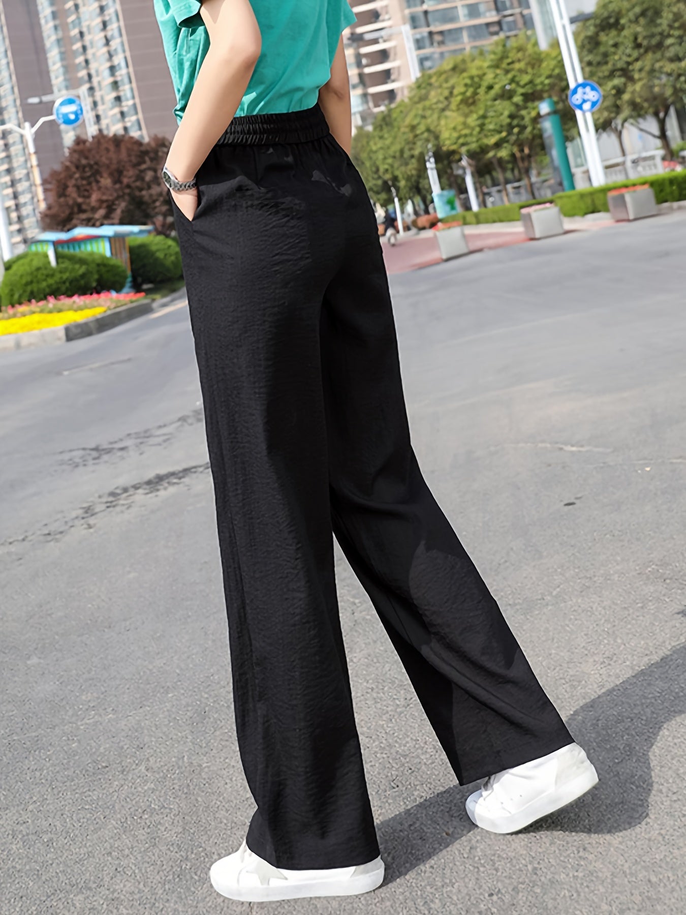 Casual outdoor look featuring stylish wide leg pants outfit paired with a green top