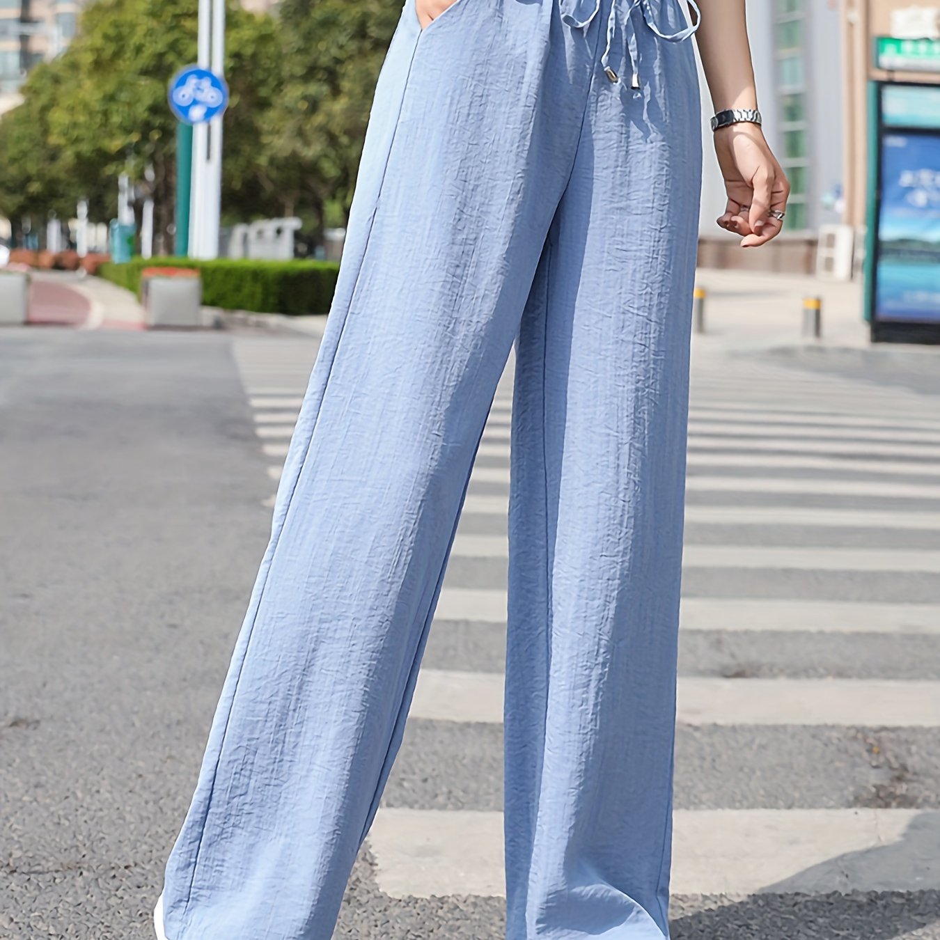 Light blue stylish wide leg pants outfit with a relaxed fit and drawstring waist for casual wear