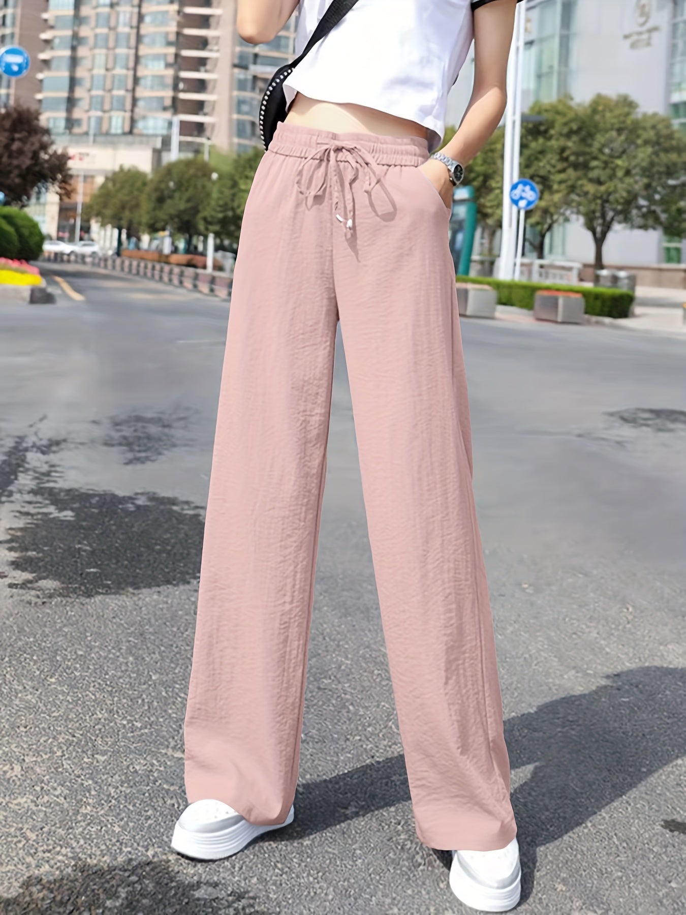 Dandych stylish wide leg pants outfit in light pink, featuring a comfortable drawstring waist and relaxed fit